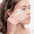 Bioderma Sensibio H2O Micellar Water removing make-up with a cotton pad
